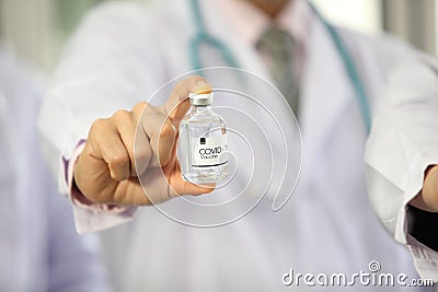 Doctor holding sample covid-19 vaccine vial Stock Photo