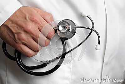 Doctor holding stethoscope Stock Photo