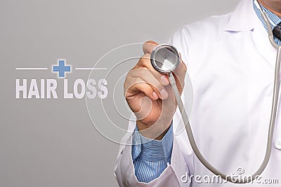 Doctor holding a stethoscope and word Stock Photo