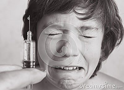 Boy aftaid of vaccination injection Stock Photo