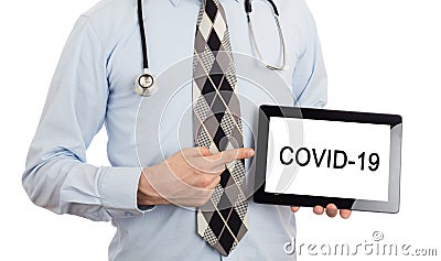 Doctor holding tablet Stock Photo