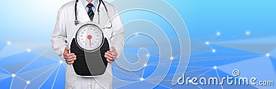 Doctor holding a weight scale Stock Photo