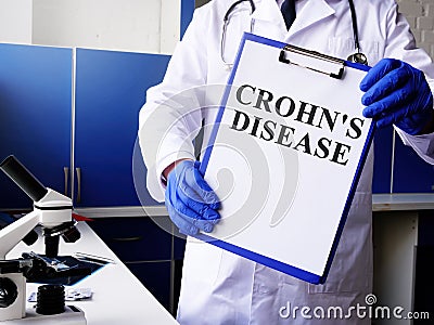 Doctor holds Crohn disease diagnosis Stock Photo