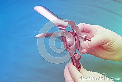 Doctor holds a disposable speculum Stock Photo