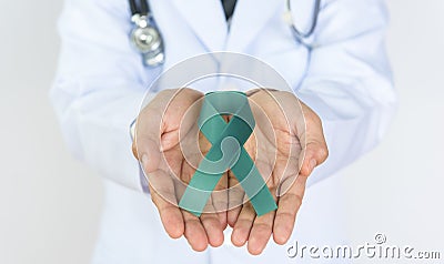 Doctor Holds green Ribbon Stock Photo