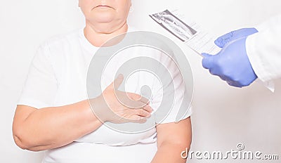 The doctor holds the results of an examination of an elderly woman who has heart problems. Cardiovascular disease Stock Photo