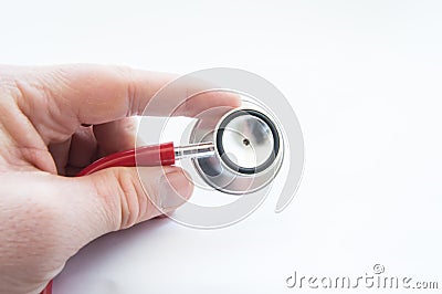 Doctor holds stethoscope, keeping index finger close up on white background. Use in medical practice, display process of auscultat Stock Photo