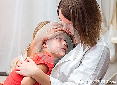 Doctor hugs and cuddle the little sick girl Stock Photo