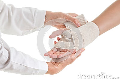 Doctor imposes an elastic bandage to the patient's hand Stock Photo