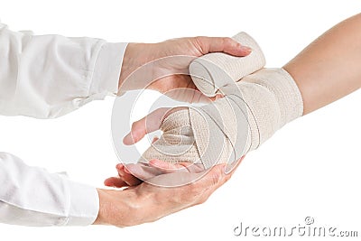 Doctor imposes an elastic bandage to the patient's hand Stock Photo