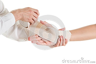 Doctor imposes an elastic bandage to the patient's hand Stock Photo