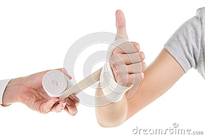 Doctor imposes an elastic bandage to the patient's hand Stock Photo