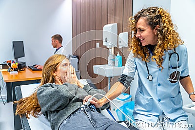 Doctor informing a patient that she is pregnant Stock Photo