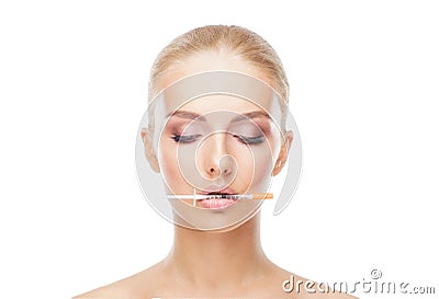 Doctor injecting in a beautiful face of a young woman. Plastic surgery concept. Stock Photo