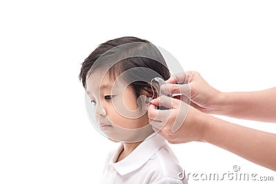 Doctor Inserting Hearing Aid Stock Photo