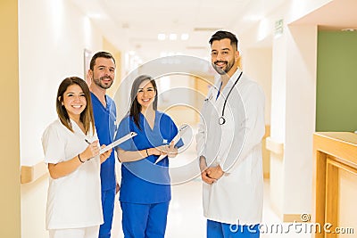 Doctor and interns standing in a hallway Stock Photo