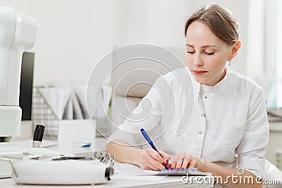 doctor interviews patient and makes entries in the medical history Stock Photo
