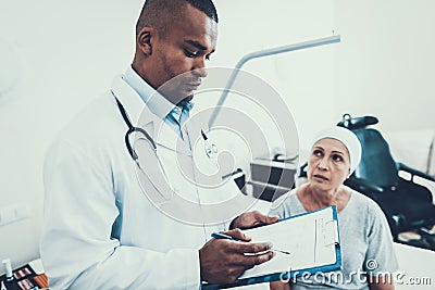 Doctor Interviews. Woman Undergoes Rehabilitation. Stock Photo
