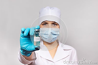 A doctor or lab technician holds a measles vaccine. Measles epidemic, measles encephalitis. The concept of vaccination in health Stock Photo