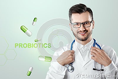 Doctor and lettering probiotics and pills image. The concept of diet, intestinal microflora, microorganisms, healthy digestion Stock Photo