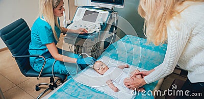 Doctor and little boy patient. Ultrasound equipment. Diagnostics. Sonography. Stock Photo