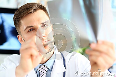 Doctor looking at x-ray image Stock Photo