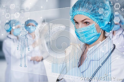 The doctor looks at the interface with patient data Stock Photo