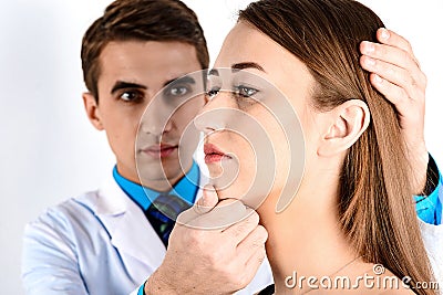 Examination of plastic surgery doctor, patient and consultation Stock Photo