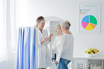 Doctor with measure tape Stock Photo