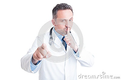 Doctor or medic making silence and quiet gesture Stock Photo