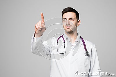 Doctor or medic pointing finger on invisible transparent screen with copy space and advertising area isolated on white background Stock Photo