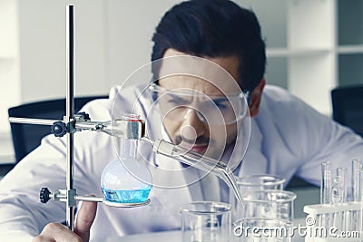 Doctor and microbiologist with vacuum tubes for samples with COVID 19 infection atypical pneumonia virus in laboratory Stock Photo