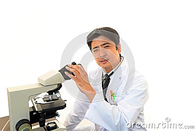 Doctor with a microscopic examination Stock Photo
