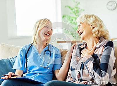 nurse doctor senior care caregiver help assistence retirement home nursing elderly woman health support Stock Photo