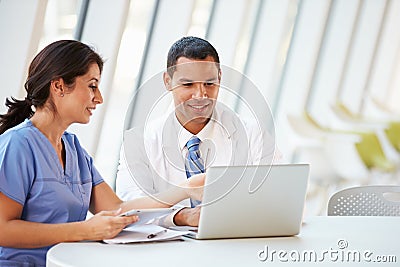 Doctor And Nurse Having Informal Meeting In Hospital Canteen Stock Photo