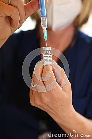 Doctor or Nurse holding Pfizer-BioNTech Covid-19 vaccine Editorial Stock Photo