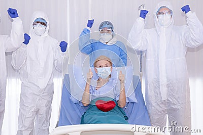 Sucessful Recovering patient resting on bed hold mini heart during Covid-19 outbreak. Stock Photo