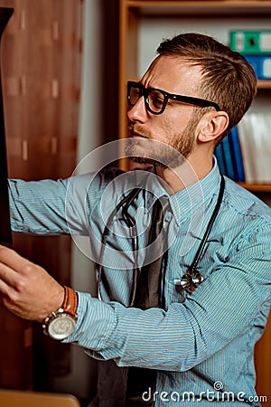 Doctor Observing X-Ray Stock Photo