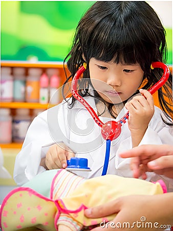 Doctor occupation role playing girl Stock Photo