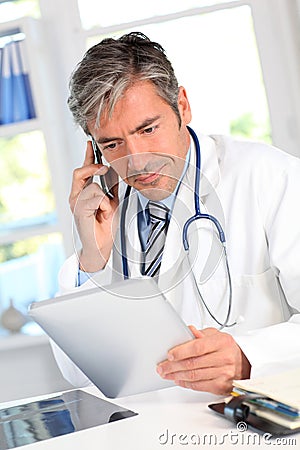 Doctor in office Stock Photo