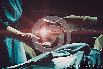 Doctor operating patient in hospital sending Surgical Blade with light flare for giving life with organ donor concept Stock Photo