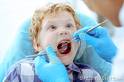 Doctor and patient child. Boy having his teeth examined with dentist. Medicine, health care and stomatology concept Stock Photo