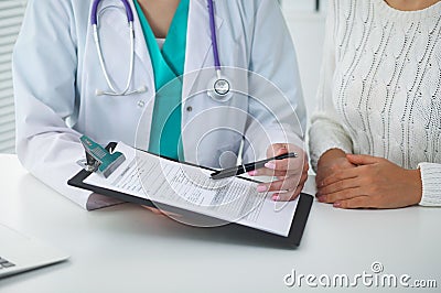 Doctor and patient, close-up of hands. Physician talking about medical examination results. Medicine, healthcare an Stock Photo