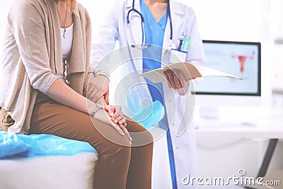 Doctor and patient discussing something while sitting at the table . Medicine and health care concept Stock Photo