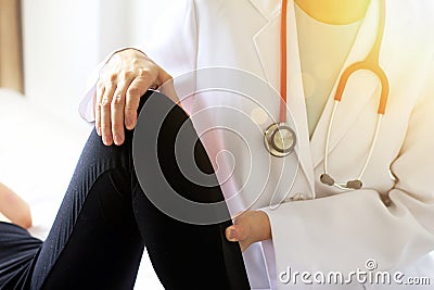 Doctor and patient, Examination of the knee pain, Sport exercise injuries. Stock Photo