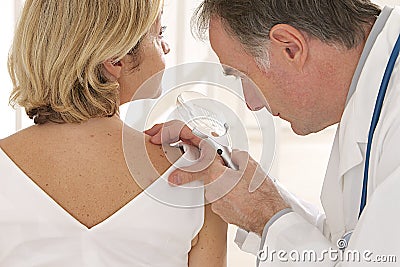 Doctor and patient - - looking for skin disease Stock Photo