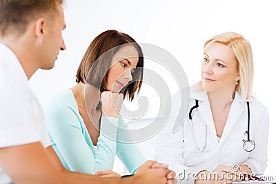 Doctor with patients in cabinet Stock Photo