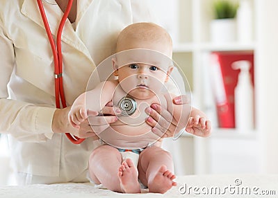 Doctor pediatric examining little child in clinic. Baby health concept Stock Photo