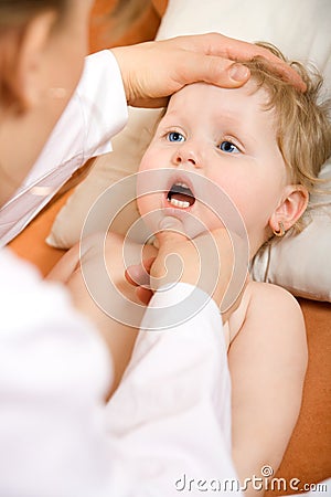 Doctor pediatrician exam baby mouth Stock Photo