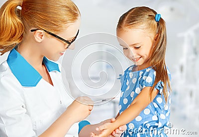 Doctor a pediatrician makes child vaccinated Stock Photo